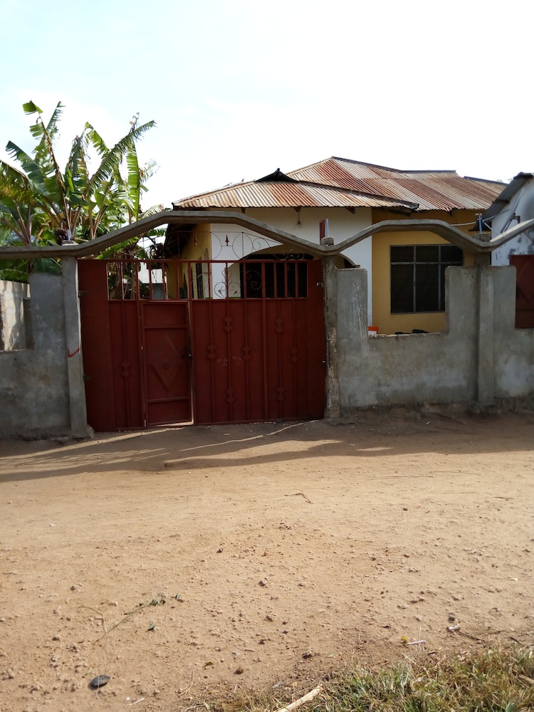 Picture from the outside of gated orphanage house in Tanzania